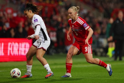 140426 - Wales v Albania - 2027 FIFA Women's World Cup Qualifying - Arbenita Curraj of Albania is challenged by Elise Hughes of Wales