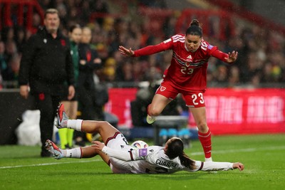 140426 - Wales v Albania - 2027 FIFA Women's World Cup Qualifying - Arbenita Curraj of Albania clashes with Ffion Morgan of Wales