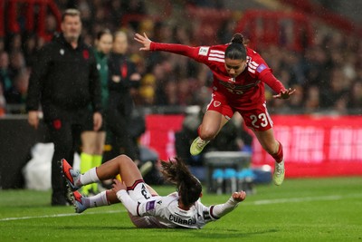 140426 - Wales v Albania - 2027 FIFA Women's World Cup Qualifying - Arbenita Curraj of Albania clashes with Ffion Morgan of Wales