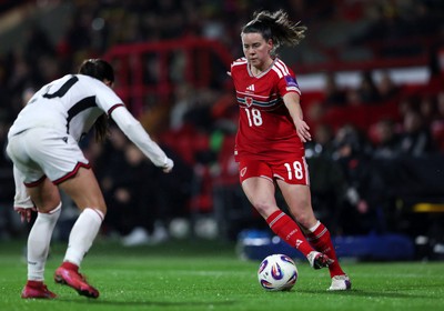 140426 - Wales v Albania - 2027 FIFA Women's World Cup Qualifying - Esther Morgan of Wales controls the ball whilst under pressure from Klea Hamonikaj of Albania