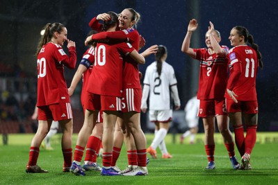 140426 - Wales v Albania - 2027 FIFA Women's World Cup Qualifying - Rhiannon Roberts of Wales celebrates scoring her team’s third goal with teammate Mared Griffiths
