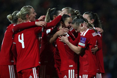 140426 - Wales v Albania - 2027 FIFA Women's World Cup Qualifying - Hannah Cain of Wales celebrates scoring her team’s fourth goal with teammate Lily Woodham