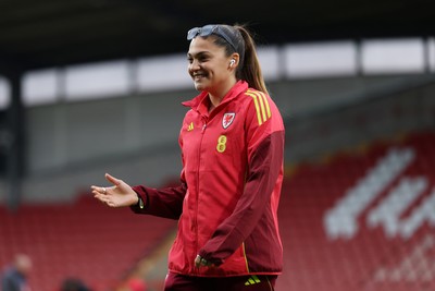 140426 - Wales v Albania - 2027 FIFA Women's World Cup Qualifying - Safia Middleton-Patel of Wales inspects the pitch prior to the game