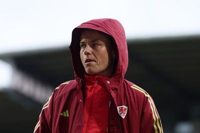 140426 - Wales v Albania - 2027 FIFA Women's World Cup Qualifying - Hayley Ladd of Wales inspects the pitch prior to the game