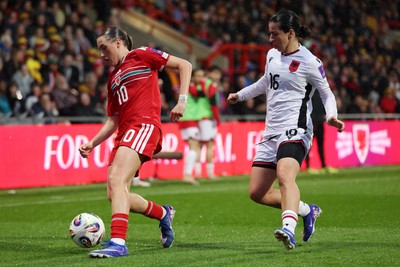 140426 - Wales v Albania - 2027 FIFA Women's World Cup Qualifying - Mared Griffiths of Wales is challenged by Ilarja Zarka of Albania