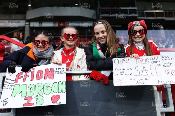 140426 - Wales v Albania - 2027 FIFA Women's World Cup Qualifying - Fans of Wales with signs prior to the game 