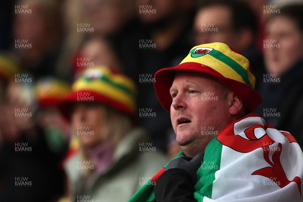 140426 - Wales v Albania - 2027 FIFA Women's World Cup Qualifying - A fan of Wales sings the national anthem
