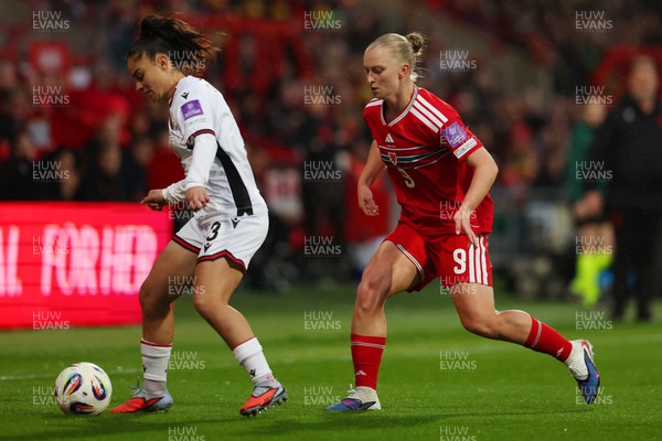 140426 - Wales v Albania - 2027 FIFA Women's World Cup Qualifying - Arbenita Curraj of Albania is challenged by Elise Hughes of Wales