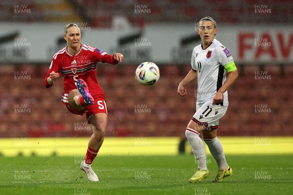 140426 - Wales v Albania - 2027 FIFA Women's World Cup Qualifying - Rhiannon Roberts of Wales passes the ball whilst under pressure from Megi Doci of Albania