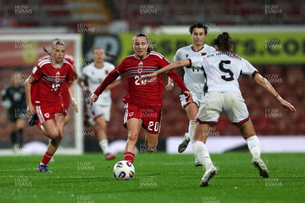 140426 - Wales v Albania - 2027 FIFA Women's World Cup Qualifying - Carrie Jones of Wales runs with the ball whilst under pressure from Arbiona Bajraktari of Albania