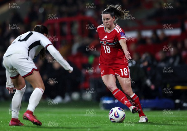 140426 - Wales v Albania - 2027 FIFA Women's World Cup Qualifying - Esther Morgan of Wales controls the ball whilst under pressure from Klea Hamonikaj of Albania