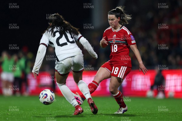 140426 - Wales v Albania - 2027 FIFA Women's World Cup Qualifying - Esther Morgan of Wales controls the ball whilst under pressure from Klea Hamonikaj of Albania