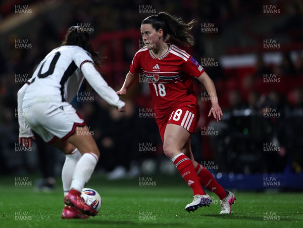 140426 - Wales v Albania - 2027 FIFA Women's World Cup Qualifying - Esther Morgan of Wales controls the ball whilst under pressure from Klea Hamonikaj of Albania
