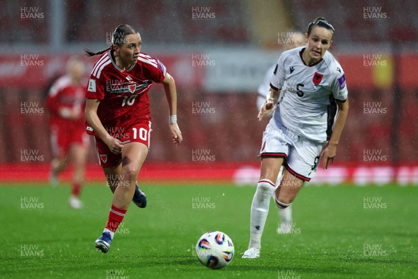 140426 - Wales v Albania - 2027 FIFA Women's World Cup Qualifying - Mared Griffiths of Wales runs with the ball whilst under pressure from Arbiona Bajraktari of Albania