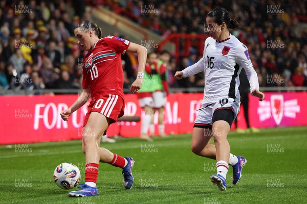 140426 - Wales v Albania - 2027 FIFA Women's World Cup Qualifying - Mared Griffiths of Wales is challenged by Ilarja Zarka of Albania