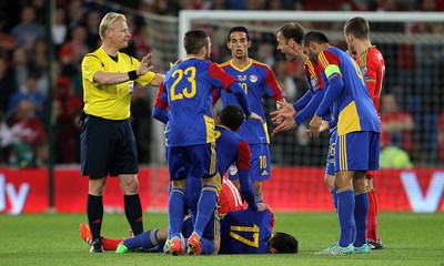 131015 - Wales v Andorra - UEFA European Championship Qualifiers - Andorra rush medics onto the pitch for Victor Moreira of Andorra