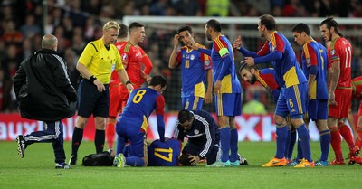 131015 - Wales v Andorra - UEFA European Championship Qualifiers - Andorra rush medics onto the pitch for Victor Moreira of Andorra