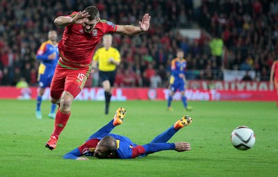 131015 - Wales v Andorra - UEFA European Championship Qualifiers - Sam Vokes of Wales goes over Gabriel Riera of Andorra