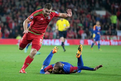 131015 - Wales v Andorra - UEFA European Championship Qualifiers - Sam Vokes of Wales goes over Gabriel Riera of Andorra