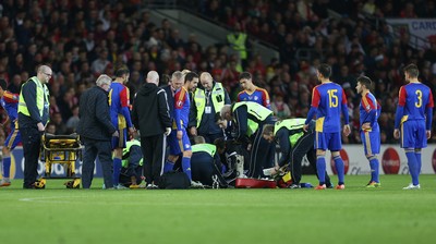 131015 - Wales v Andorra, UEFA European Championship Qualifier - Victor Moreira of Andorra receives extensive medical help after being injured, before being stretchered off