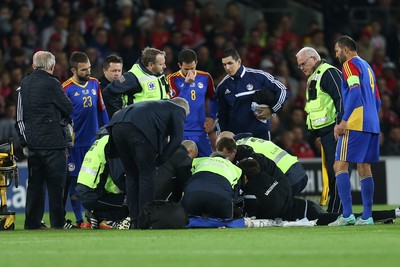 131015 - Wales v Andorra, UEFA European Championship Qualifier - Victor Moreira of Andorra receives extensive medical help after being injured, before being stretchered off