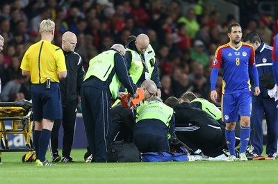 131015 - Wales v Andorra, UEFA European Championship Qualifier - Victor Moreira of Andorra receives extensive medical help after being injured, before being stretchered off