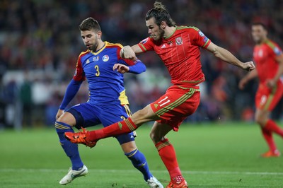 131015 - Wales v Andorra, UEFA European Championship Qualifier - Gareth Bale of Wales shoots at goal as Moises San Nicolas of Andorra challenges