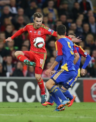 131015 - Wales v Andorra, UEFA European Championship Qualifier - Aaron Ramsey of Wales plays the ball past Max Llovera of Andorra