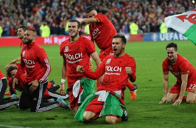 131015 - Wales v Andorra, UEFA European Championship Qualifier - Aaron Ramsey of Wales and Gareth Bale of Wales lead the celebrations at the end of the match