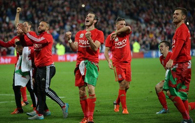 131015 - Wales v Andorra, UEFA European Championship Qualifier - Aaron Ramsey of Wales and Gareth Bale of Wales lead the celebrations at the end of the match