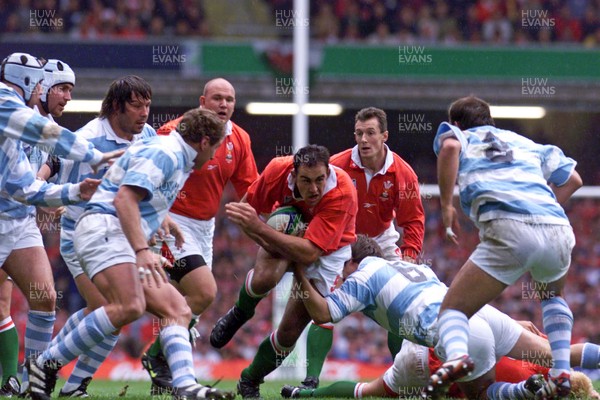 011099 - Wales v Argentina - Rugby World Cup - Chris Wyatt of Wales is tackled by Santiago Phelan