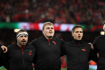 091125 - Wales v Argentina - Quilter Nations Series -  Liam Belcher, Archie Griffin and Kieran Hardy of Wales sing the anthem