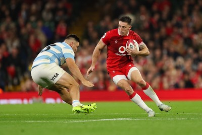 091125 - Wales v Argentina, Quilter Nations Series - Josh Adams of Wales takes on Santiago Carreras of Argentina