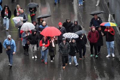 091125 - Wales v Argentina - Quilter Nations Series - Wales fans walk down Westgate Street in Cardiff in the rain ahead of the match