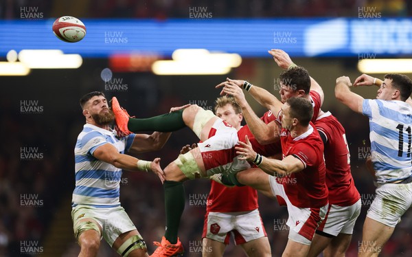 121122 - Wales v Argentina, Autumn Nations Series - Will Rowlands of Wales is left horizontal as he taps the ball back