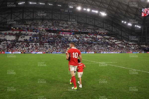 141023 - Wales v Argentina - Rugby World Cup Quarter Final - Dan Biggar of Wales on the field at full time with his children