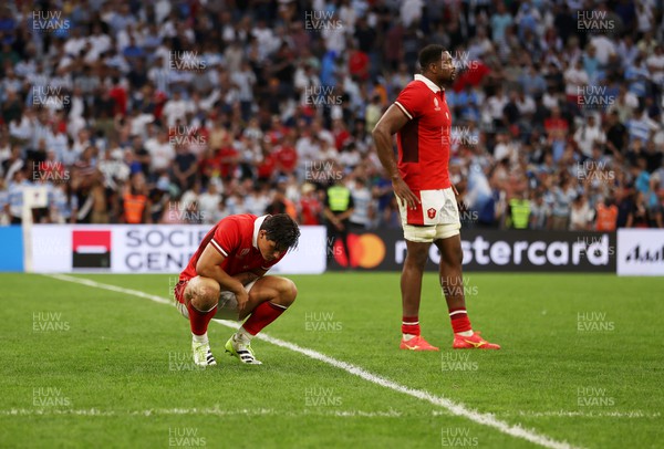 141023 - Wales v Argentina - Rugby World Cup Quarter Final - Dejected Louis Rees-Zammit and Christ Tshiunza of Wales 