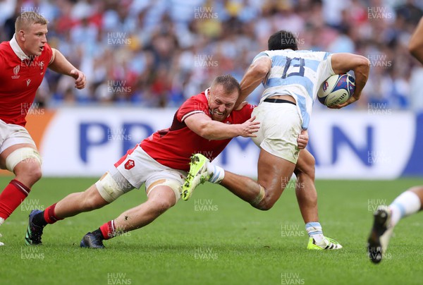 141023 - Wales v Argentina - Rugby World Cup Quarter Final - Lucio Cinti of Argentina is tackled by Tommy Reffell of Wales 