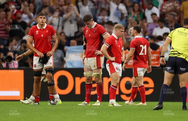 141023 - Wales v Argentina - Rugby World Cup Quarter Final - Dejected Dafydd Jenkins, Will Rowlands and Sam Costelow of Wales 