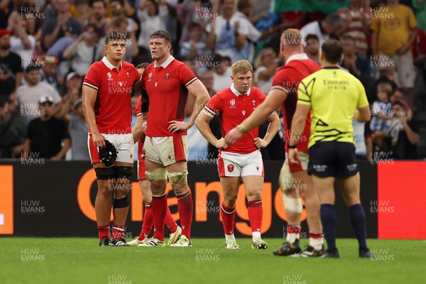 141023 - Wales v Argentina - Rugby World Cup Quarter Final - Dejected Dafydd Jenkins, Will Rowlands and Sam Costelow of Wales 