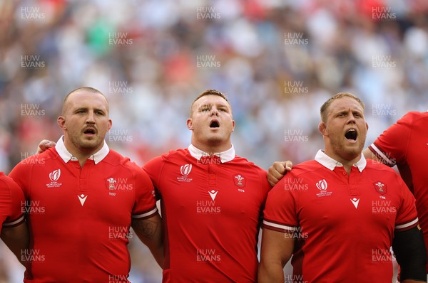 141023 - Wales v Argentina - Rugby World Cup Quarter Final - Dillon Lewis, Dewi Lake and Corey Domachowski of Wales sing the anthem