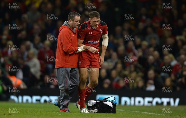 161113 - Wales v Argentina - Dove Men Series 2013 -Cory Allen of Wales is helped from the field by team doctor Geoff Davies