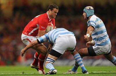 20.08.11 - Wales v Argentina - RWC Warm-Up Match - Jamie Roberts of Wales is tackled by Julio Farias Cabello of Argentina. 
