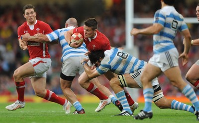 20.08.11 - Wales v Argentina - RWC Warm-Up Match - Tavis Knoyle of Wales is tackled by Juan Martin Fernandez Lobbe of Argentina. 