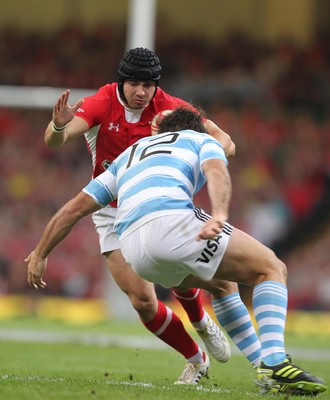 20.08.11 Wales v Argentina. Wales' Leigh Halfpenny is tackled by Argentina's Santiago Fernandez. 