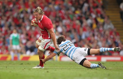 20.08.11 Wales v Argentina. Wales' Andy Powell is tackled by Argentina's Juan Imhoff. 