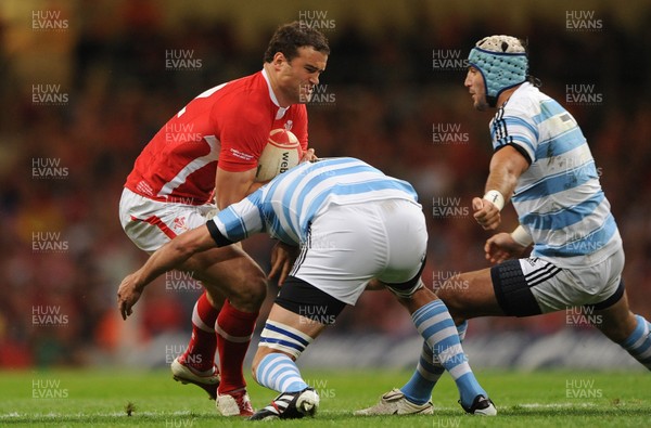20.08.11 - Wales v Argentina - RWC Warm-Up Match - Jamie Roberts of Wales is tackled by Julio Farias Cabello of Argentina. 