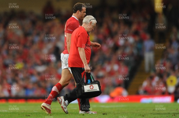 20.08.11 - Wales v Argentina - RWC Warm-Up Match - Jamie Roberts of Wales leaves the field with team doctor Prof John Williams. 