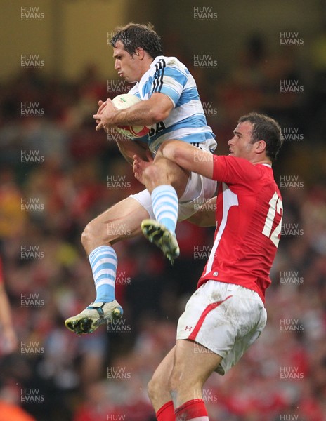 20.08.11 Wales v Argentina. Argentina's Horacio Agulla is tackled by Jamie Roberts. 