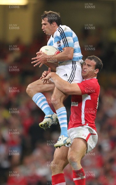 20.08.11 Wales v Argentina. Argentina's Horacio Agulla is tackled by Jamie Roberts. 